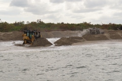 Crews working at the beach discharge area.
