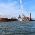 Dredge W506 Washing Off the Scow